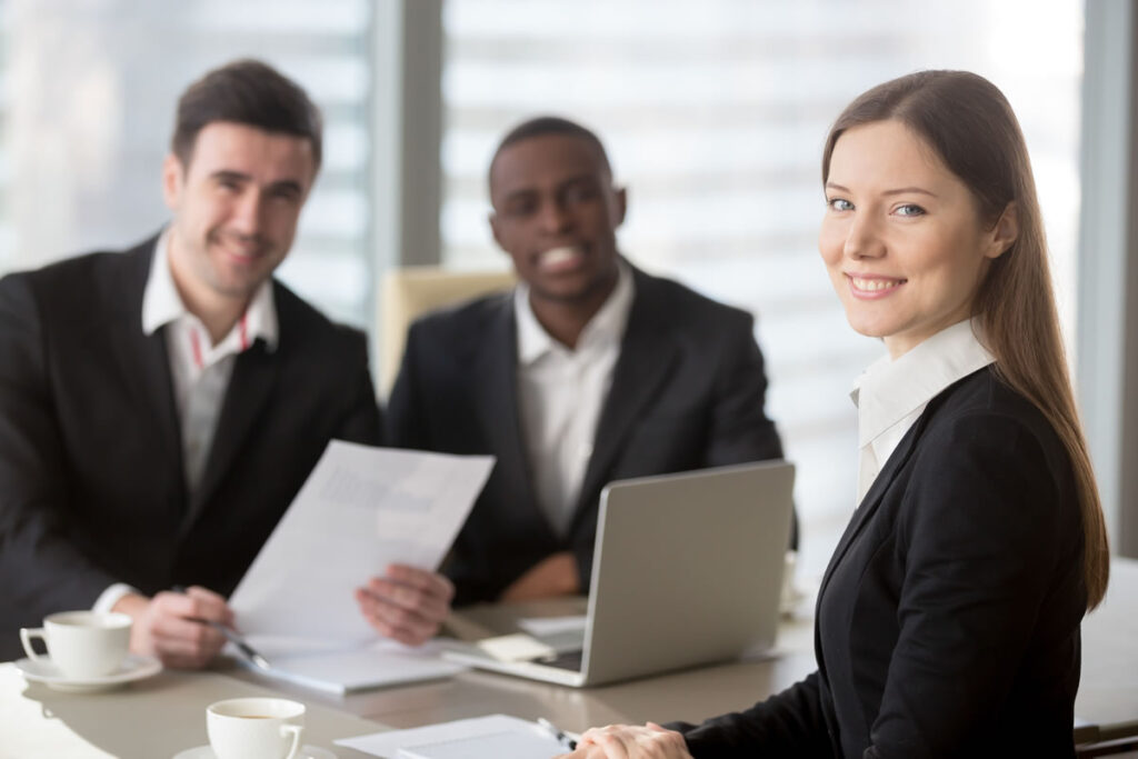 Three newly qualified patent attorneys in meeting
